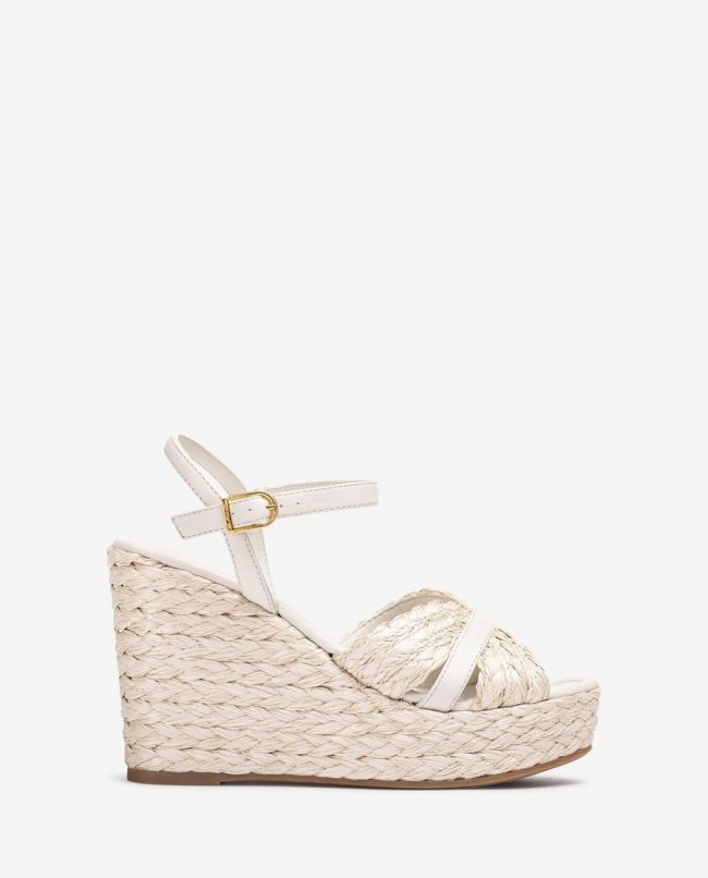 Sandales compensées hautes en raphia Unisa pour femme - Blanc Sandales compensées hautes en raphia Unisa pour femme - Blanc